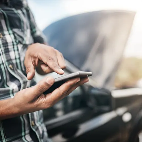 man with broken down car man with broken down car