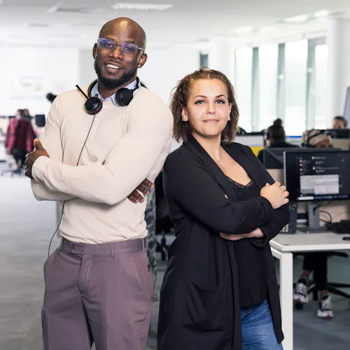 two people standing in the office two people standing in the office