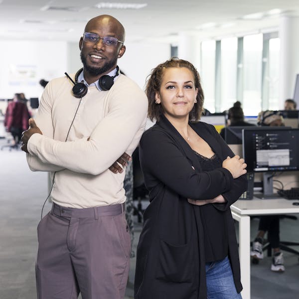 two people standing in the office two people standing in the office