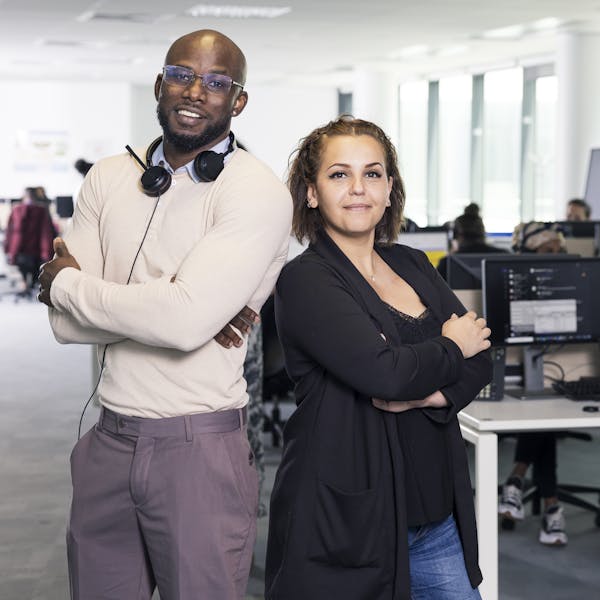 two people standing in the office two people standing in the office