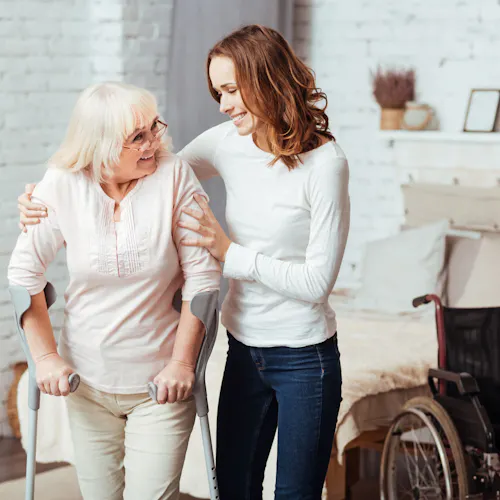 woman helps an elderly person woman helps an elderly person