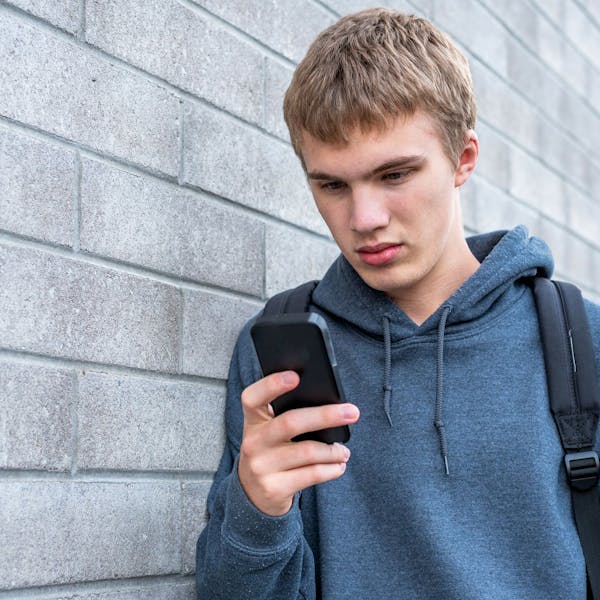 young boy with phone