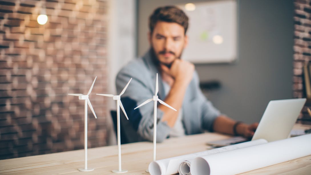 man with little wind turbine man with little wind turbine