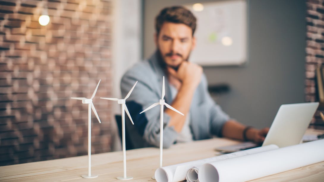 man with little wind turbine