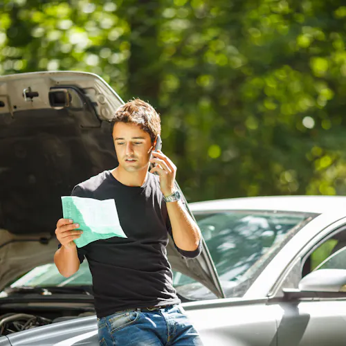 man with broken down car man with broken down car