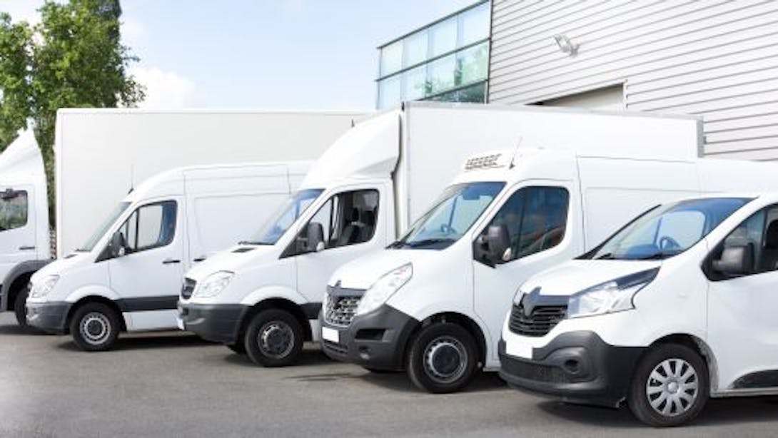 Commercial vehicles, lorries and vans parked in a car park