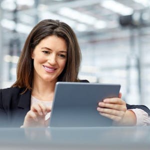 A woman consulting her tablet