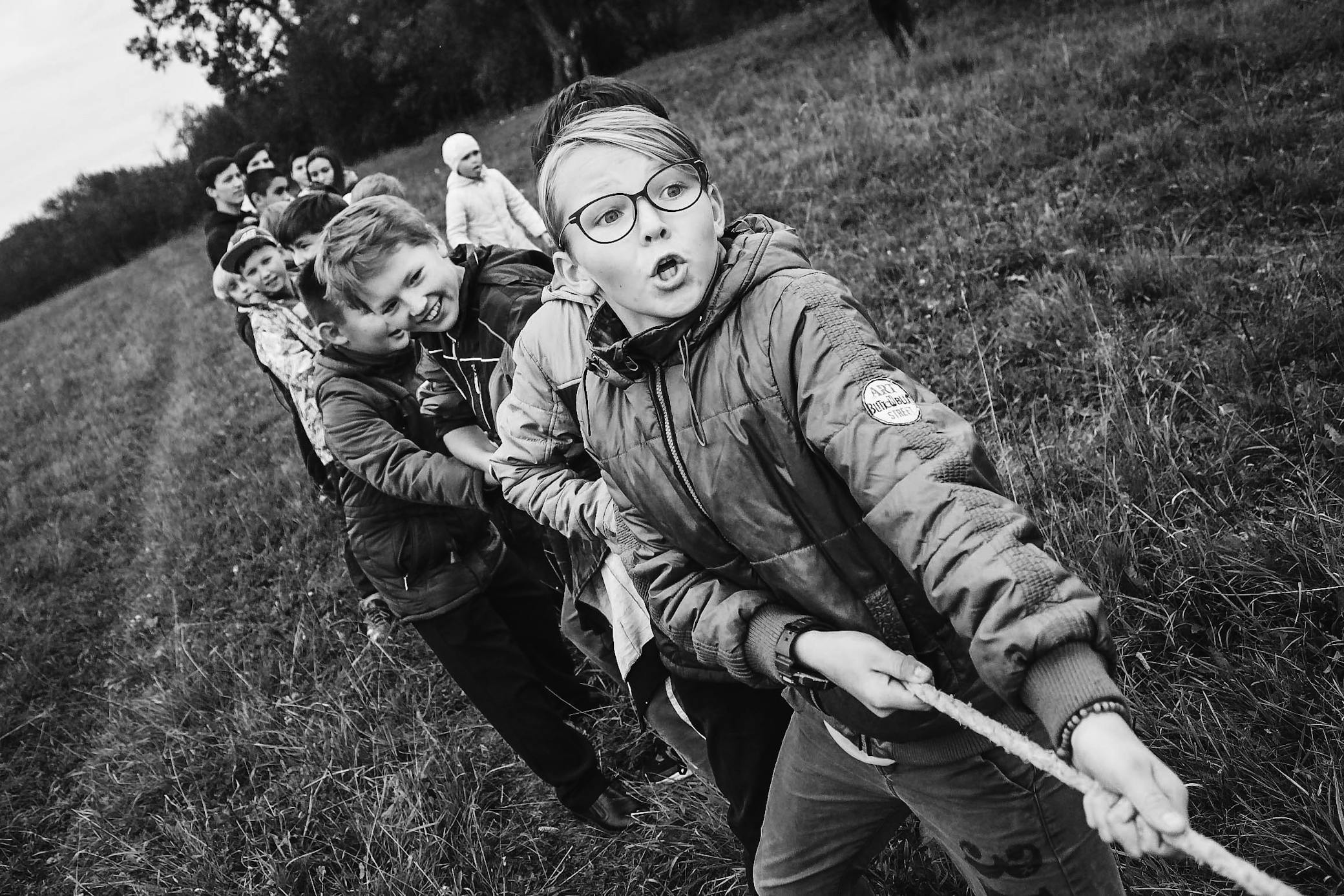 A group of children pull arope during a game of tug of war