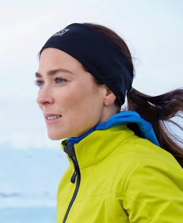 Female athlete in running gear with headband during outdoor training session