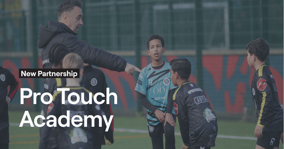 Football coach instructing young players during a training session with "New Partnership" and "Pro Touch Academy" text.