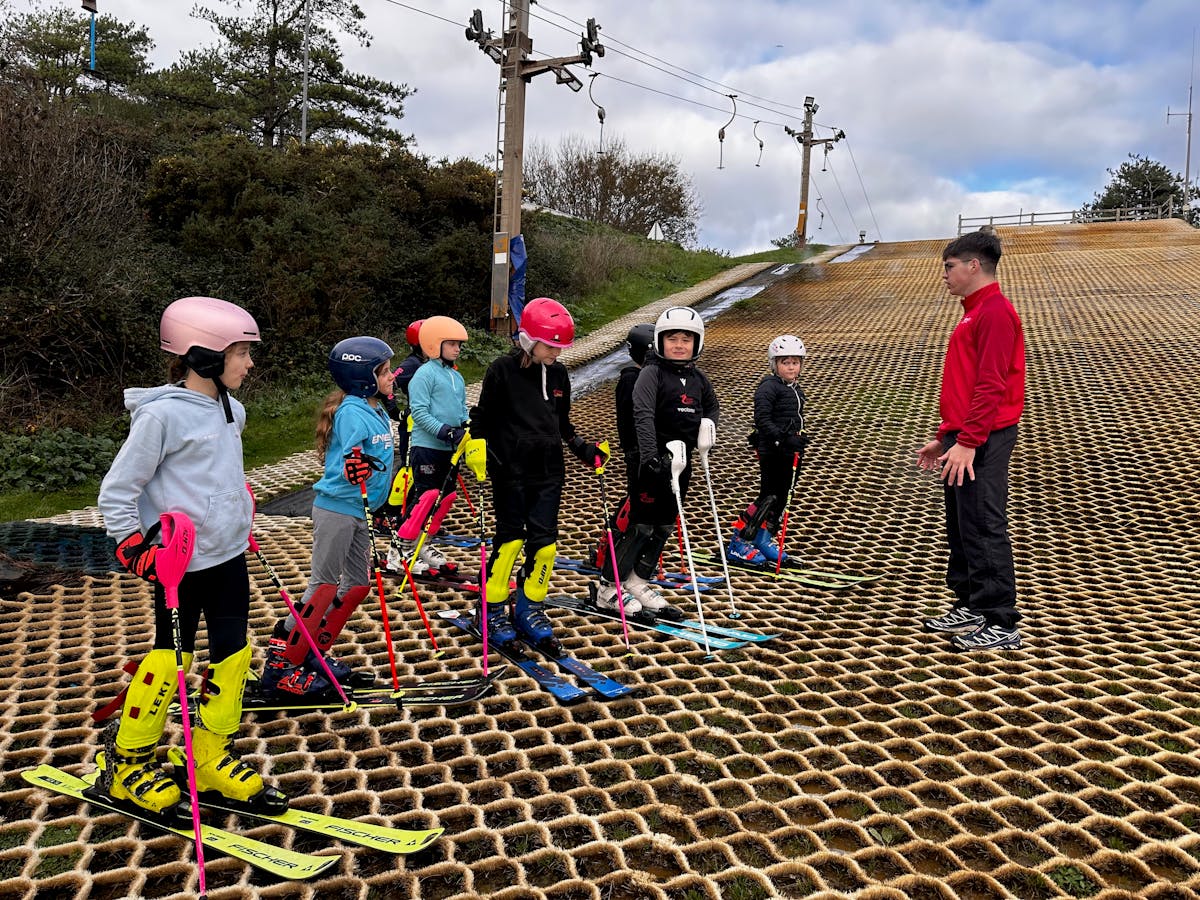 oung skiers participating in grassroots snowsport session at Welsh dry slope facility