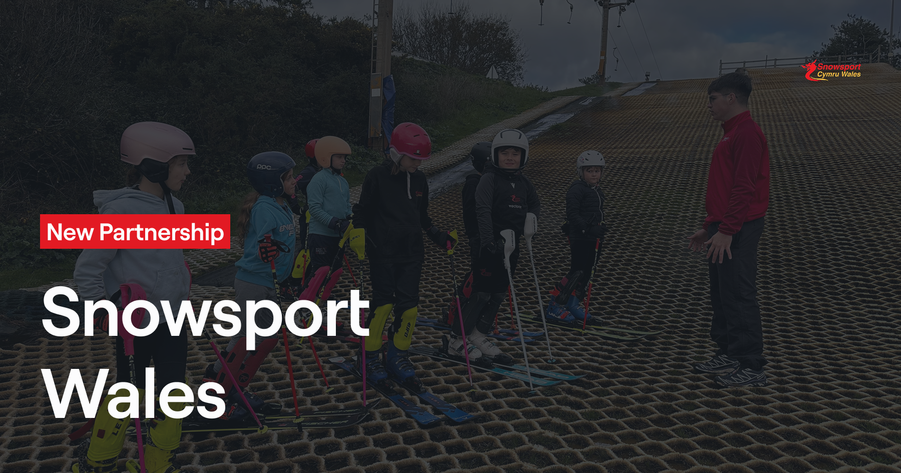Adaptive snowsport athlete receiving instruction as part of inclusive Snowsport Wales programme
