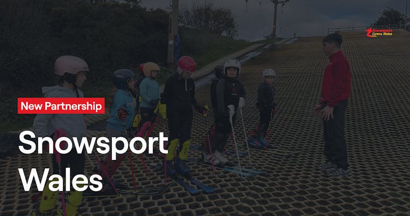 Adaptive snowsport athlete receiving instruction as part of inclusive Snowsport Wales programme