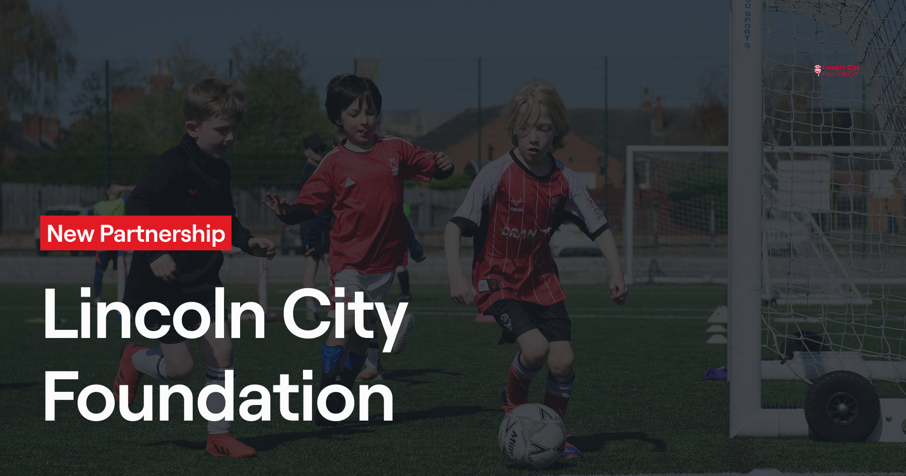 Young players develop their skills during a Lincoln City Foundation coaching session. The partnership announcement showcases the Foundation's commitment to grassroots football development in the local community, providing quality coaching and facilities for aspiring young footballers.