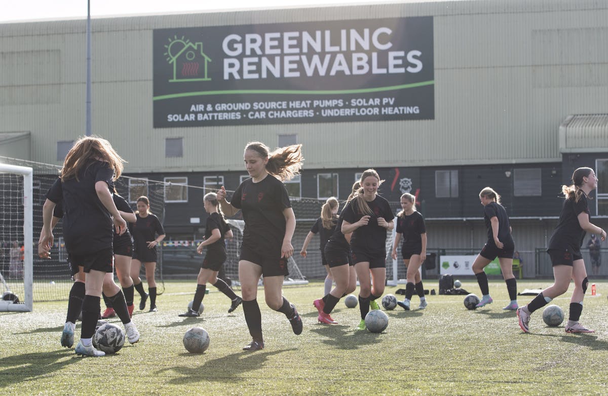 Girls' football thrives at Lincoln City Foundation's modern training facilities. Players participate in structured training sessions that focus on technical development, teamwork, and building confidence through sport. The Foundation's investment in facilities and coaching ensures equal opportunities for all young players.