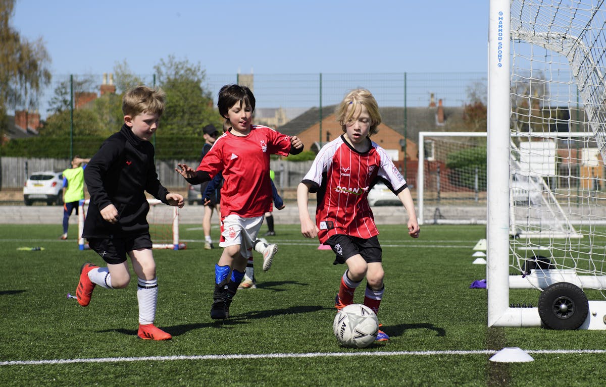 outh players engage in small-sided games at Lincoln City Foundation's training ground, with the iconic Lincoln Cathedral providing a stunning backdrop. The use of differentiated training bibs helps coaches organize effective practice sessions that maximize player development and engagement.