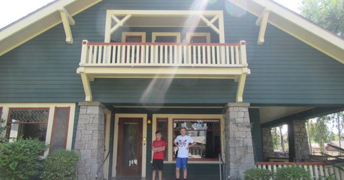 Aidan and Ian Standing in front of their downtown Redlands bungalow style AirBnB