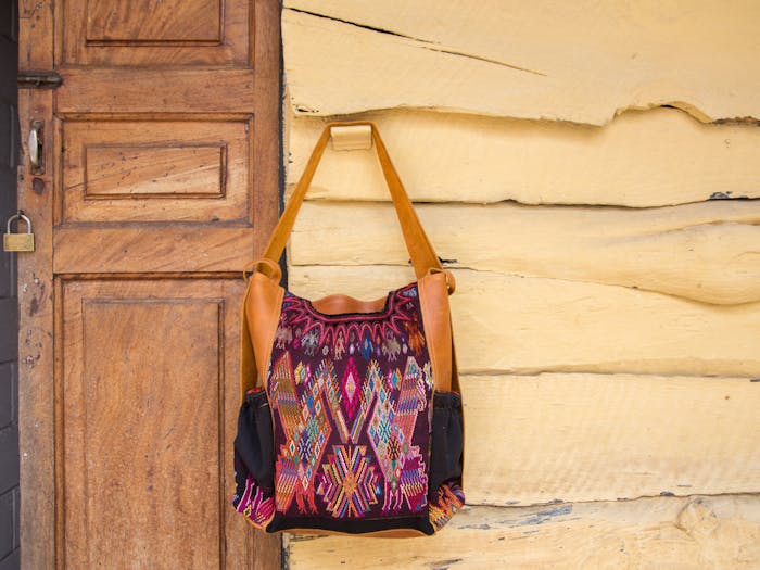 PATZIK 40 - convertible backpack/tote is made with 100% hand woven upcycled huipils and genuine leather.Designed with flexibility and simplicity in mind