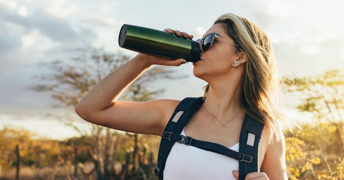 Don't just bring water. Make sure you drink it while hiking. Once you feel thirsty, you're already starting to get dehydrated. 