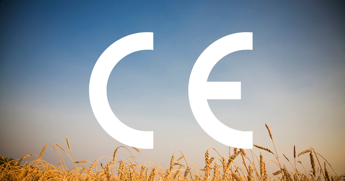 CE mark symbol overlaying a background of blue sky with a field of wheat at the bottom.