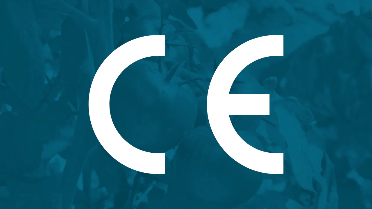 CE mark symbol over a blue tinted background showing tomatoes growing on the vine