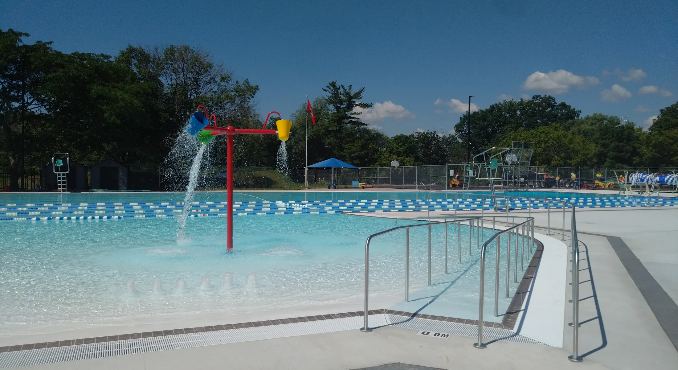 Nelson Pool Menu An outdoor leisure and lap pool on a sunny day. The pool has zero depth ...