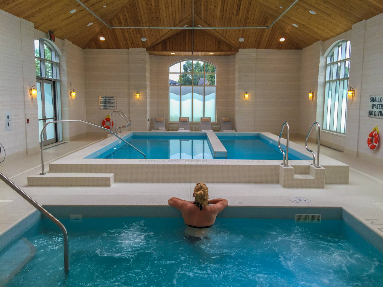 Swimmer leaning over the edge of a spa.