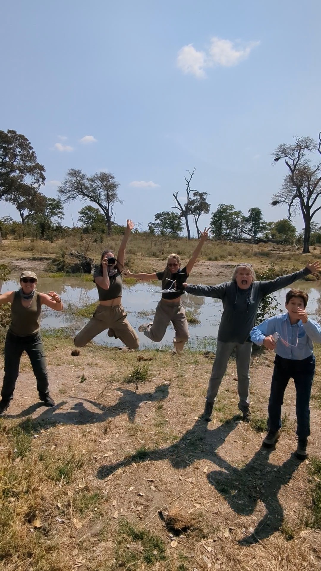 Volunteers jumping in happiness