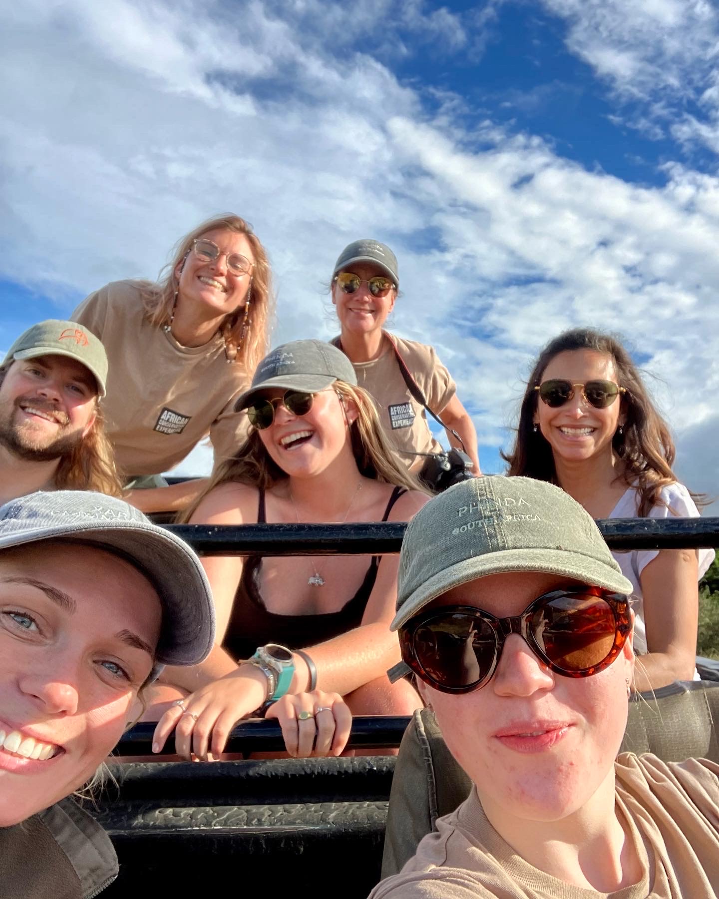 GVI cancellation: group of volunteers posing in a vehicle