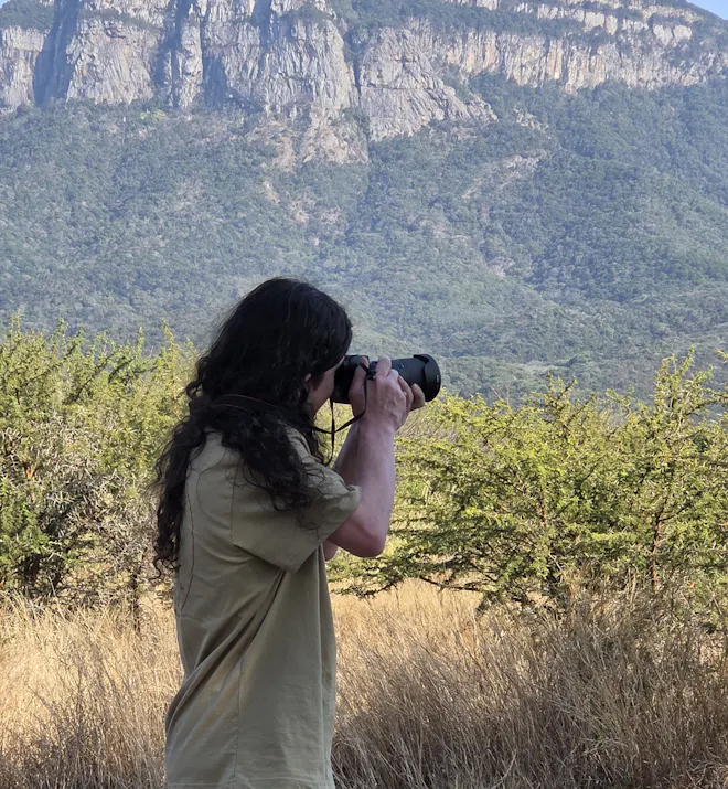 Volunteer taking a photo during his time on the Moholoholo project - Lucas Sutton