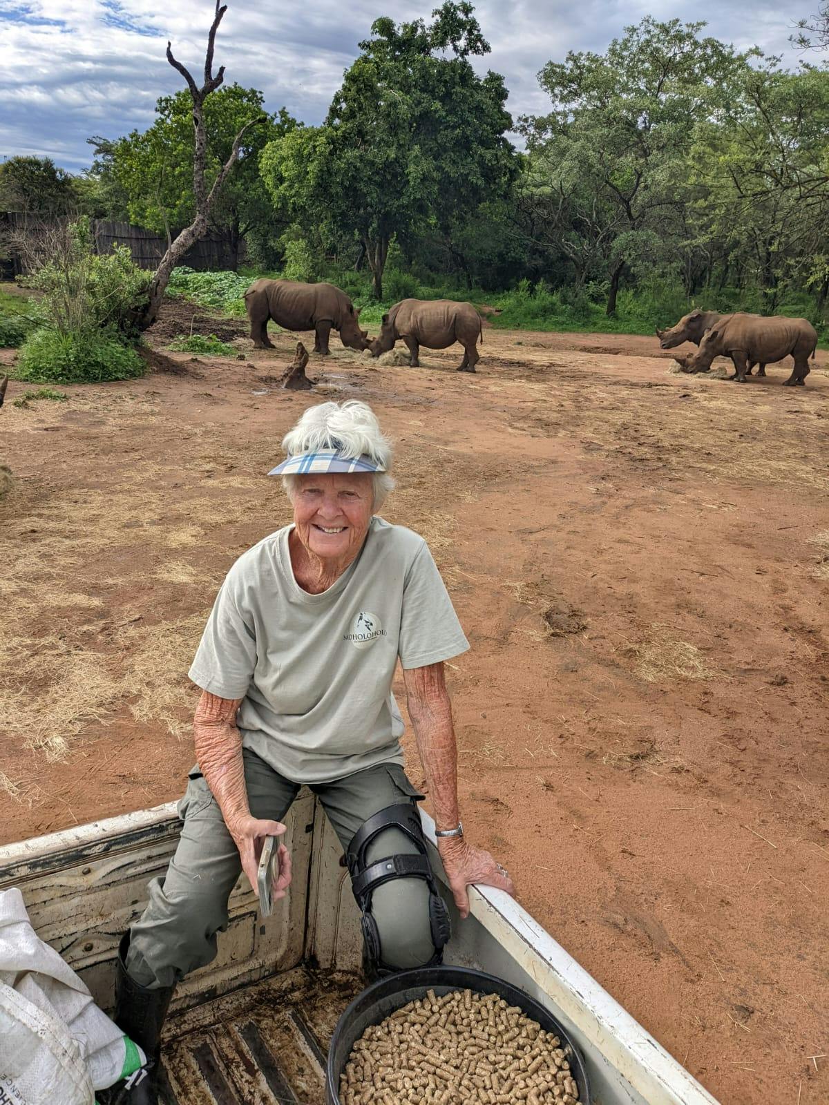 Frances Watson: posing with rhinos in the background