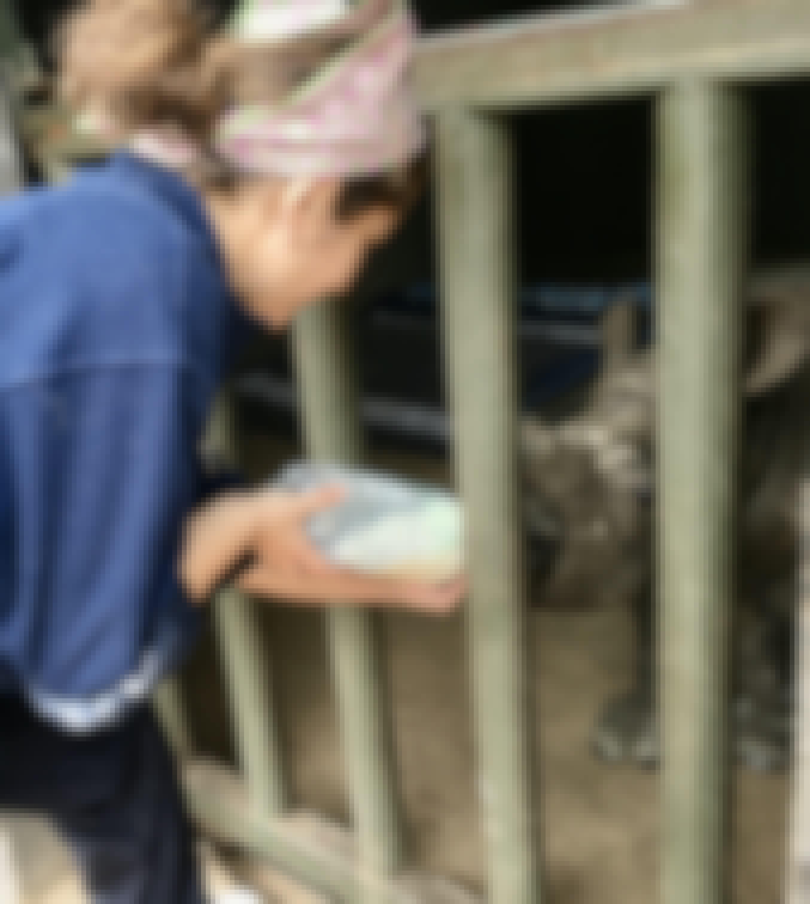 Rachele Stoppoloni: bottle feeding a baby rhino