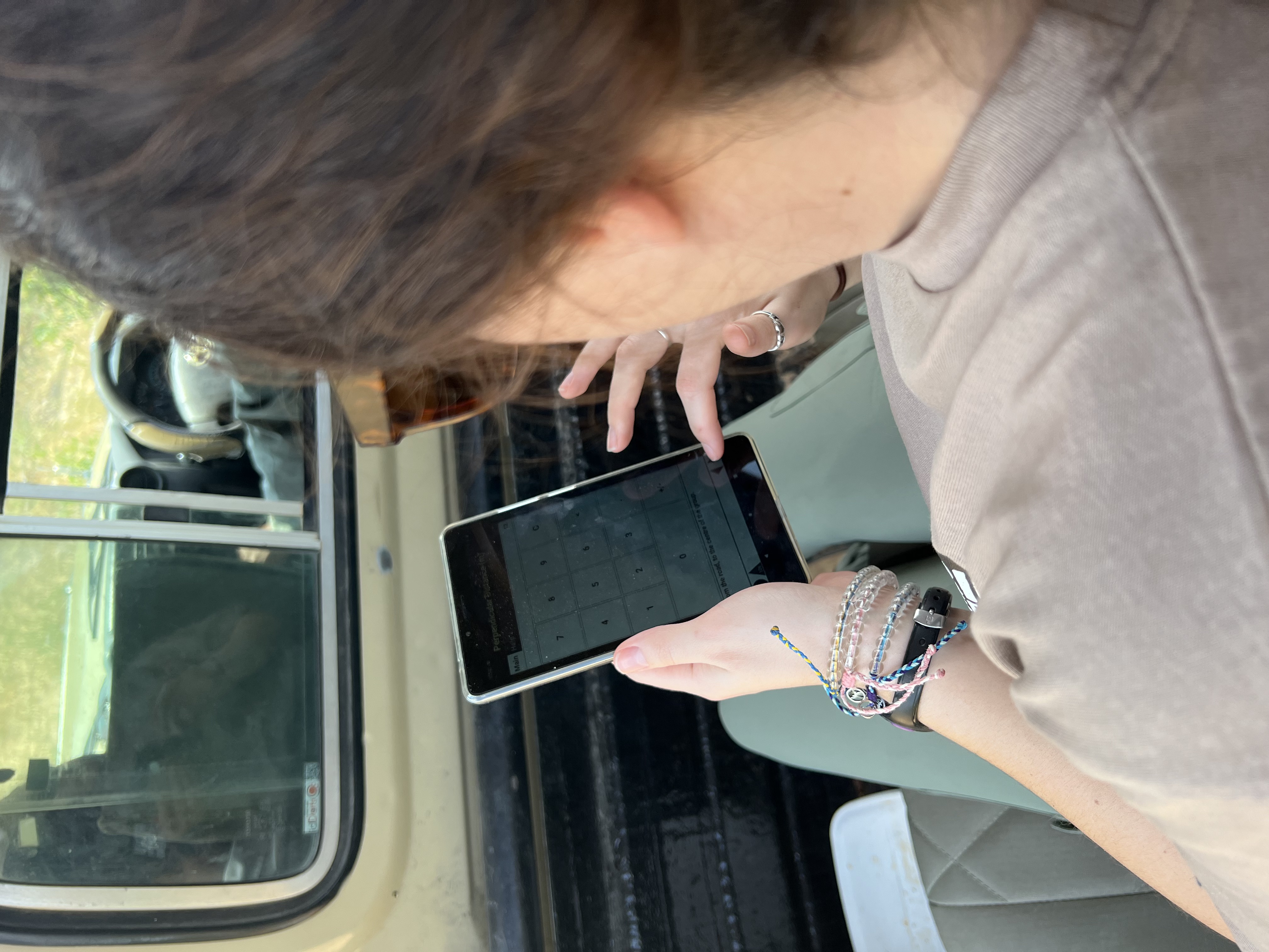 Josie and Adam: A female volunteer entering data in the Okavango