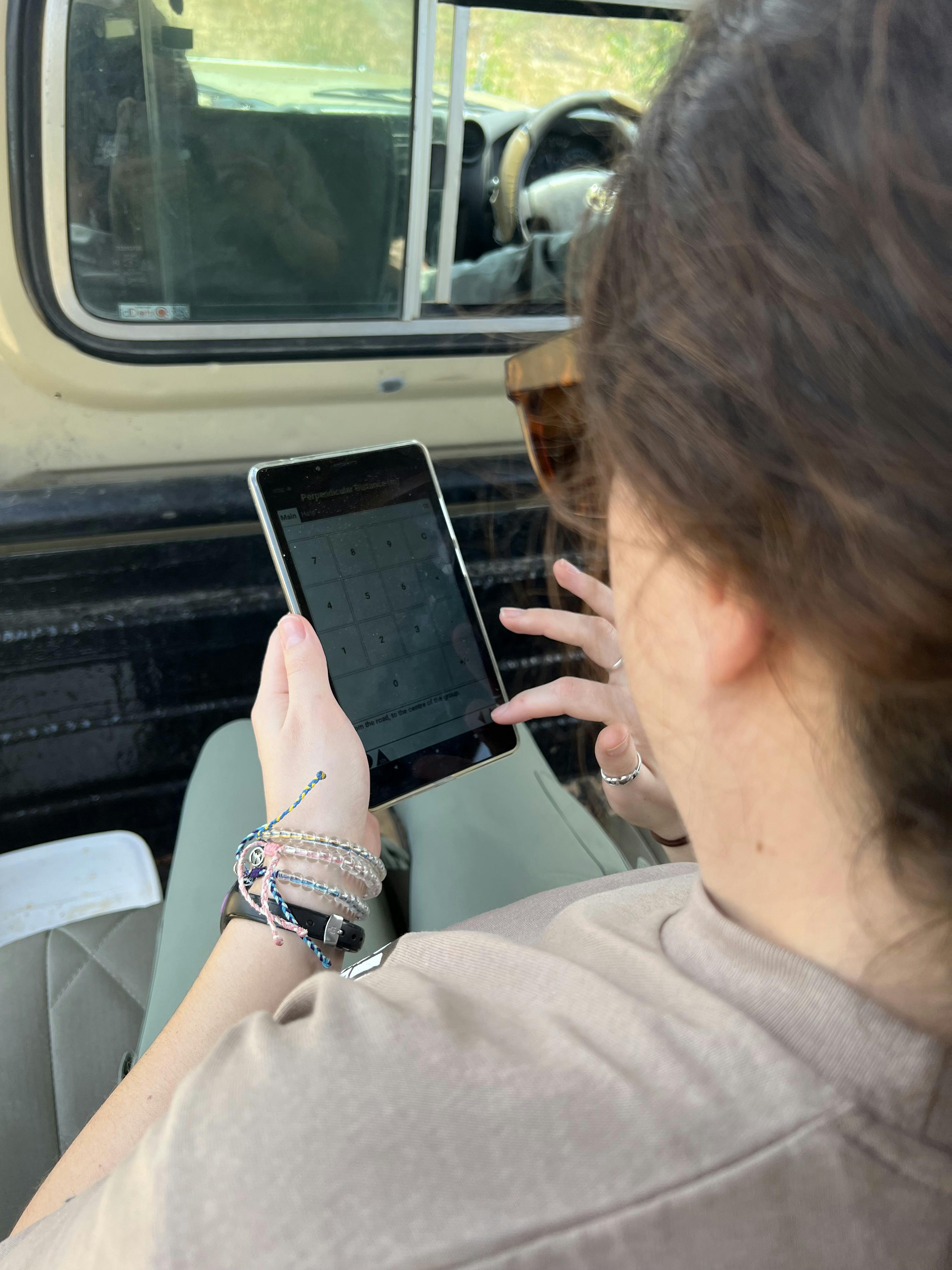 A female volunteer entering data in the Okavango