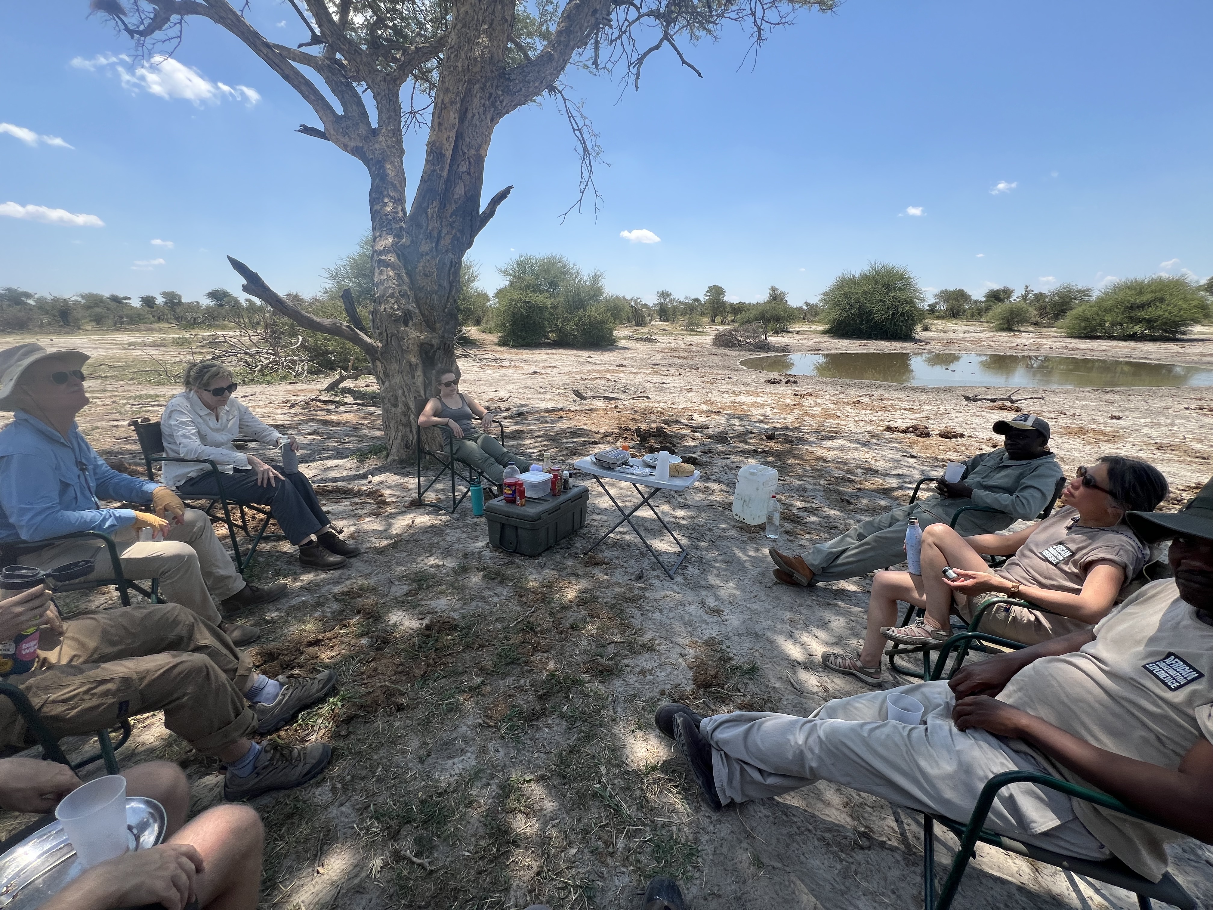 Josie and Adam: A volunteer relax in the shade in the the Okavango