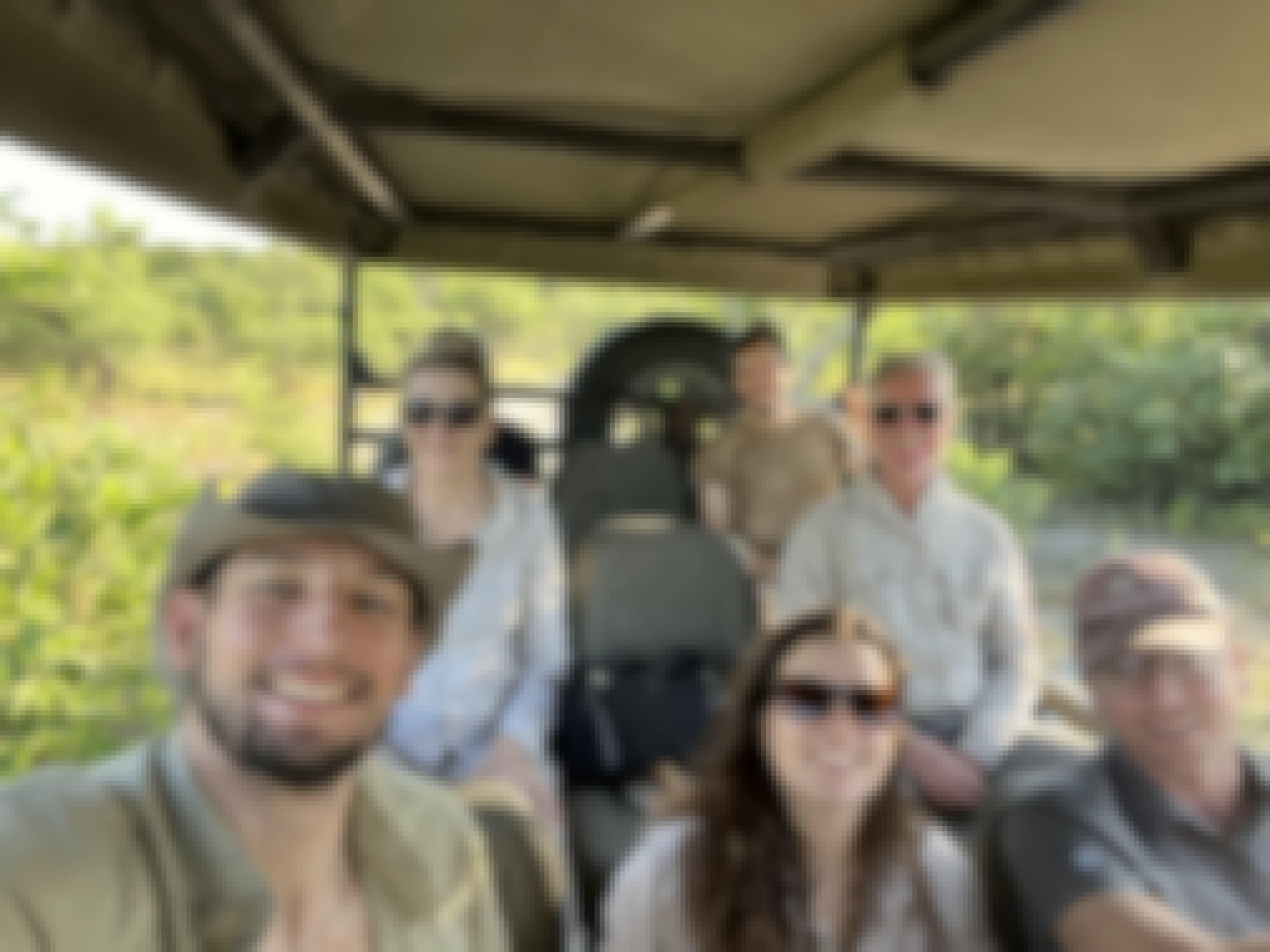A group of volunteers in a vehicle in the the Okavango