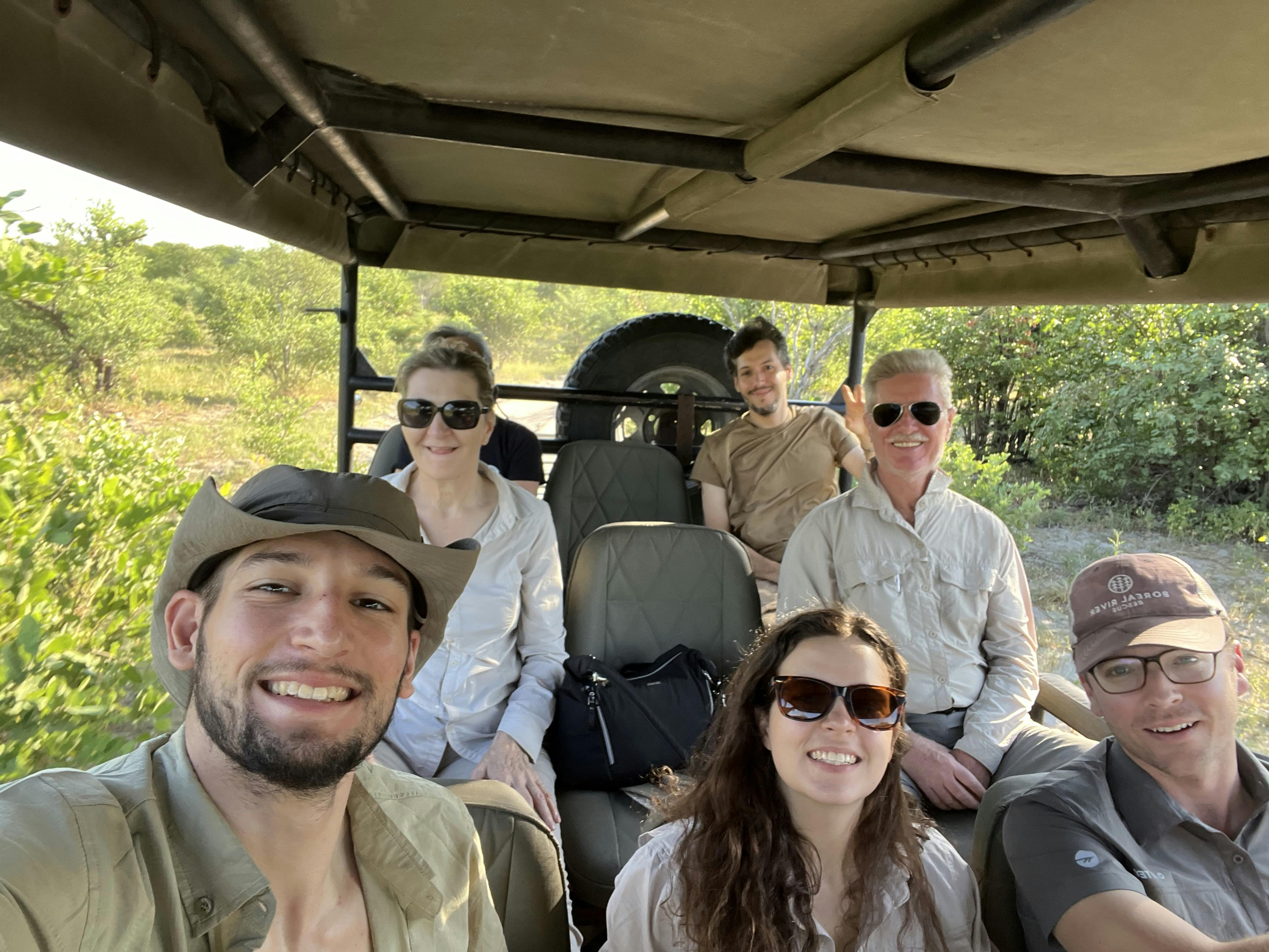A group of volunteers in a vehicle in the the Okavango