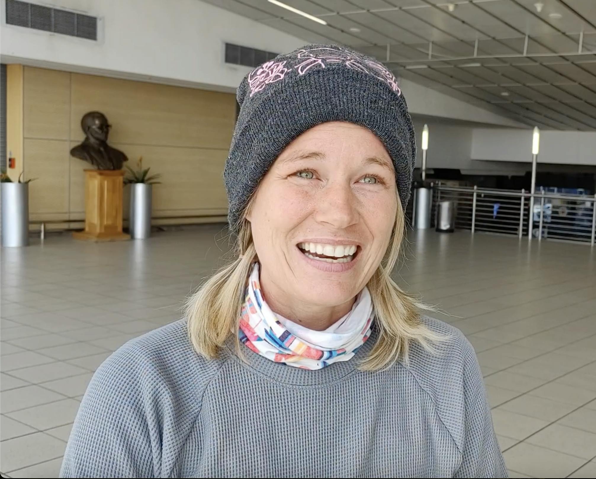 Rachel Binger: female volunteer standing in airport