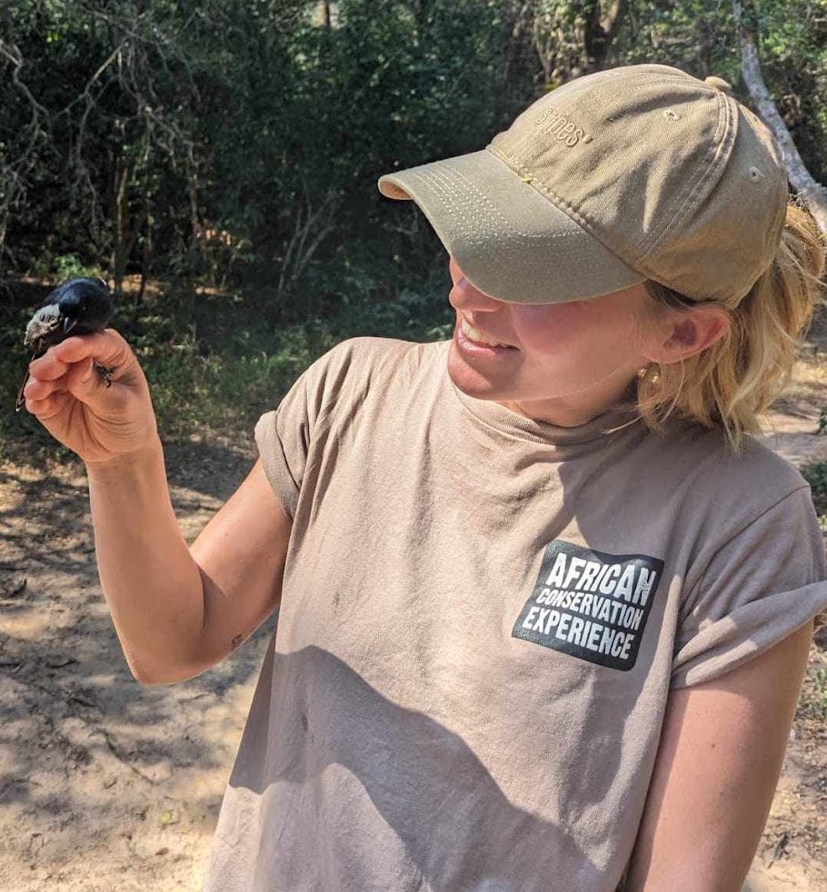 Nathalie Neumann: Female volunteer holding a bird