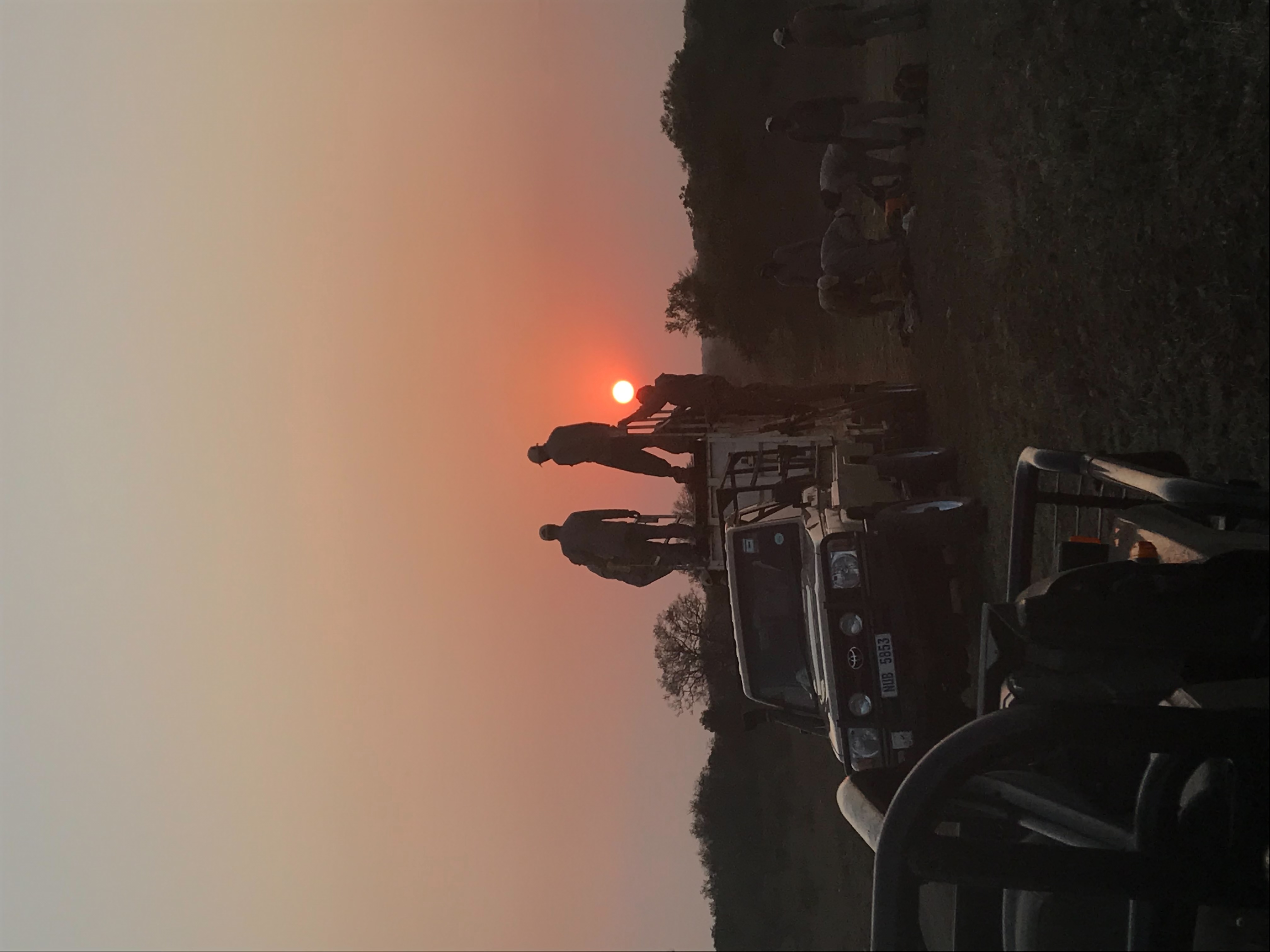 Isabelle Hogarth: A group stand on a vehicle