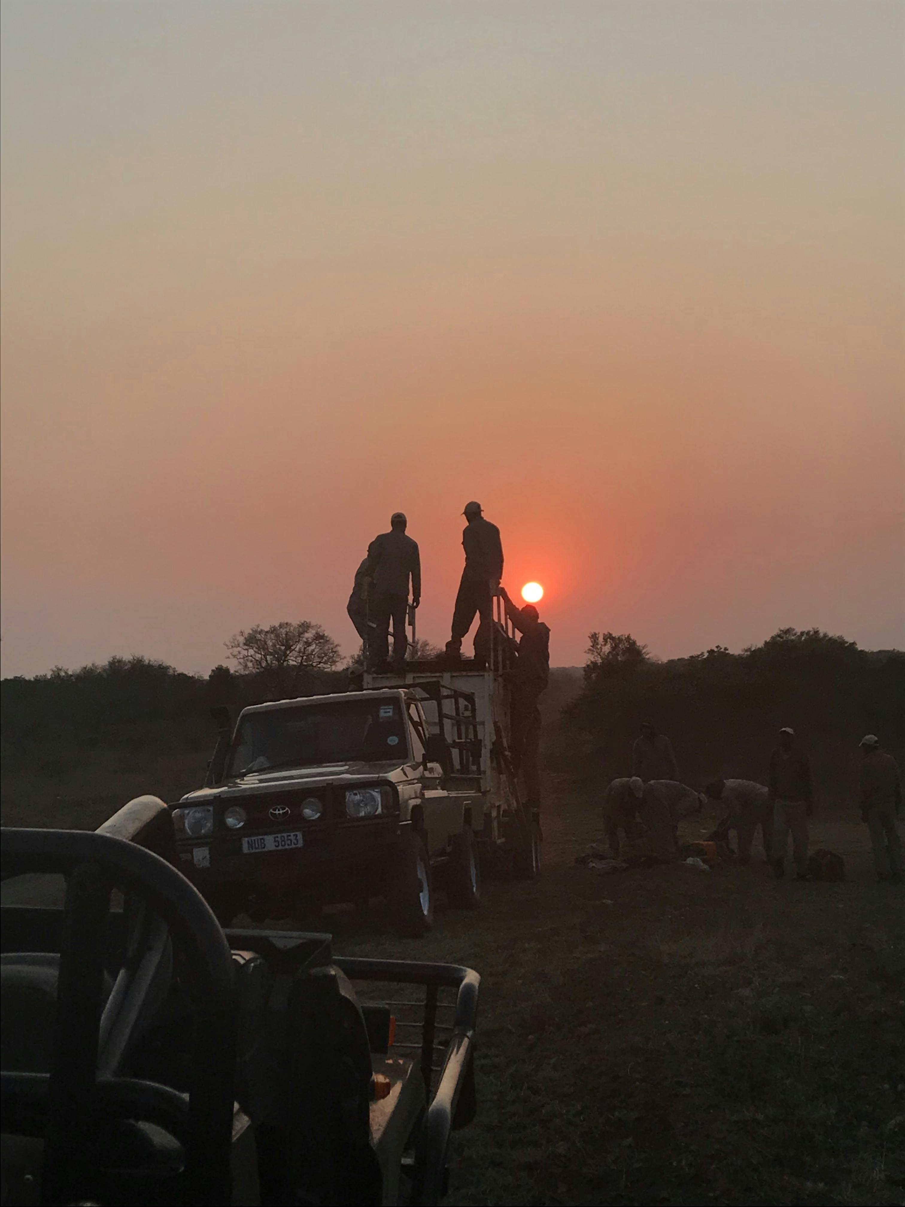 A group stand on a vehicle 