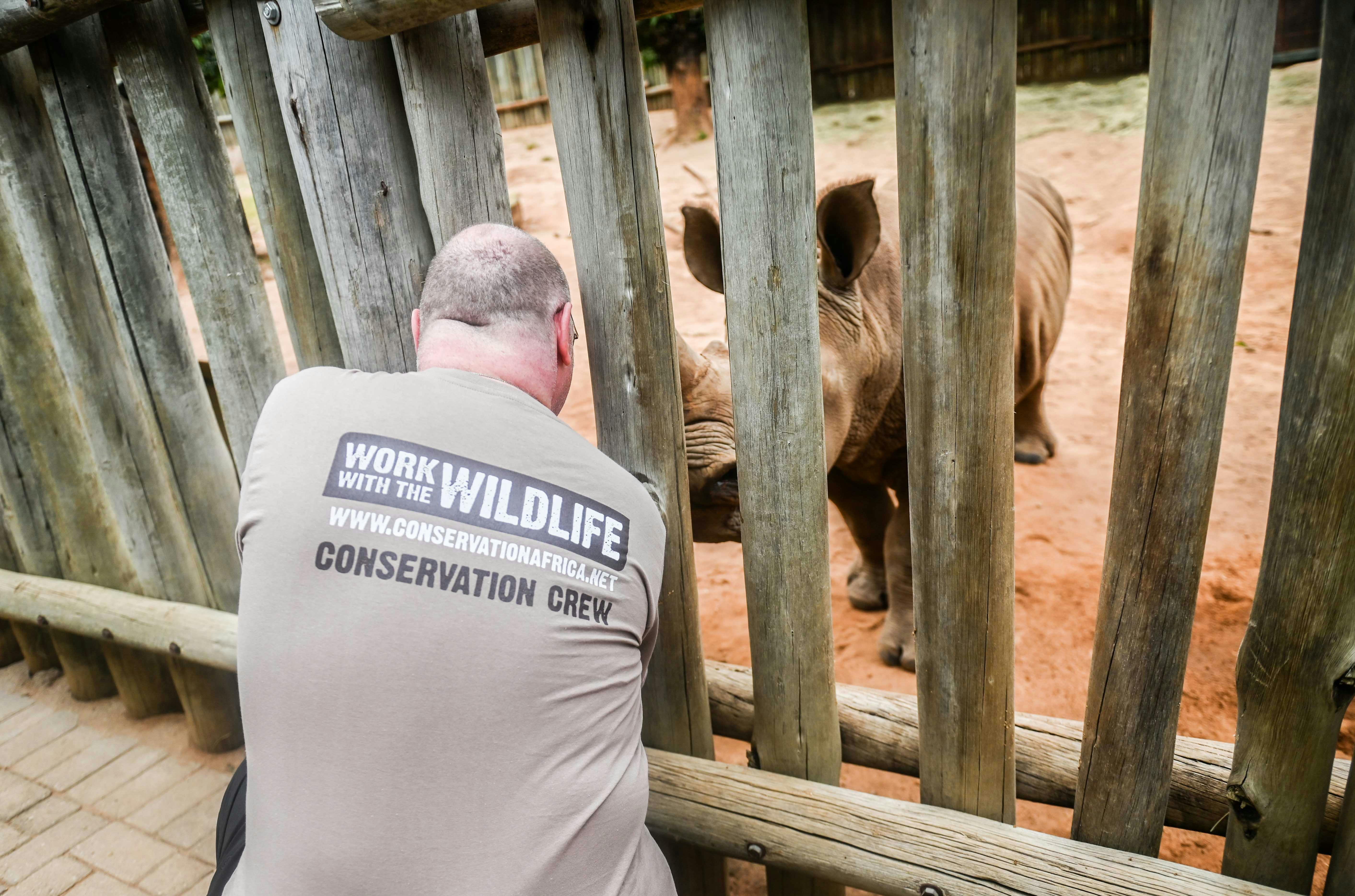 Terence and Victoria Fitzpatrick: bottle feeding a rhino at Care for Wild Africa
