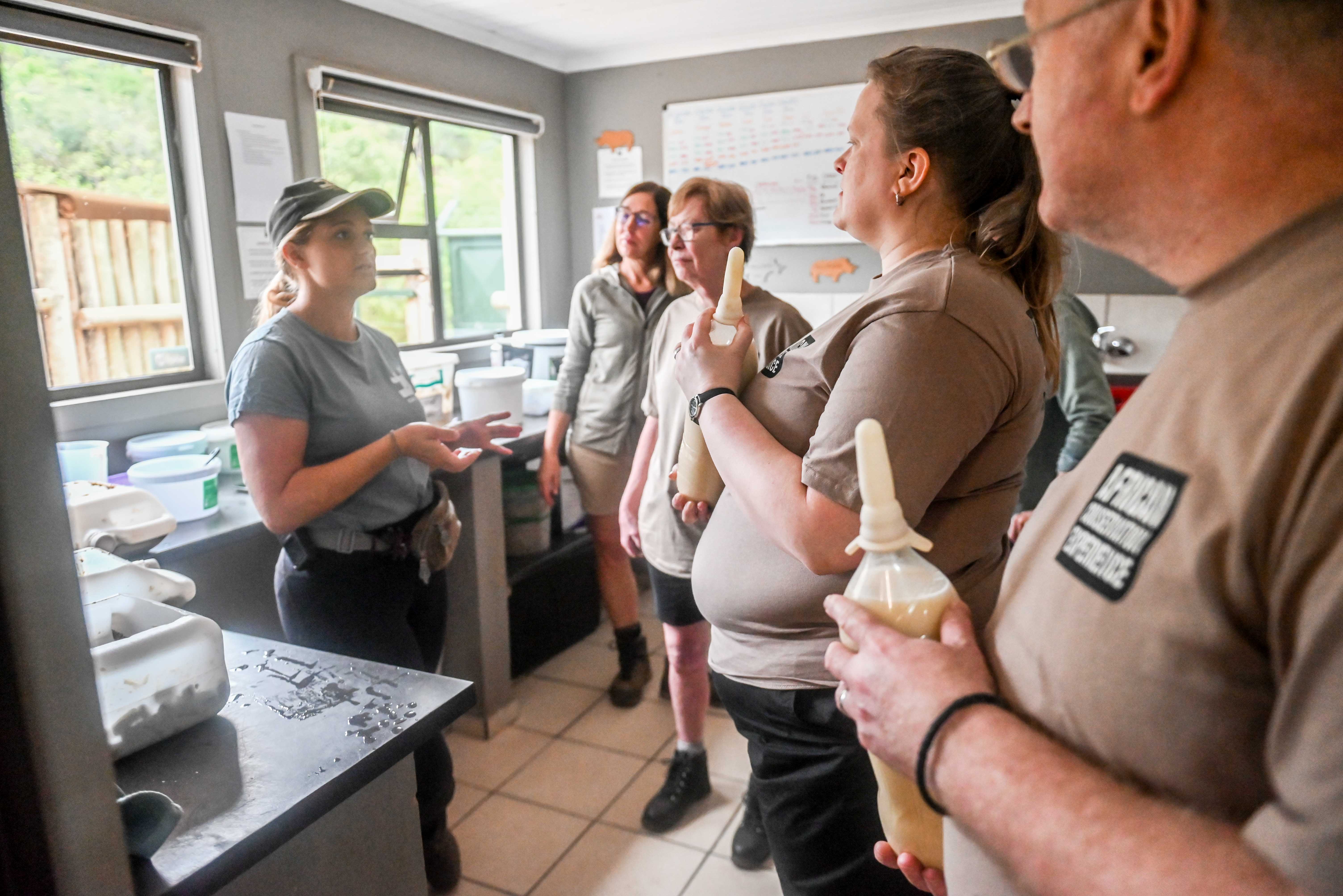 Terence and Victoria Fitzpatrick: holding bottles, about to feed the rhino calves at Care for Wild Africa