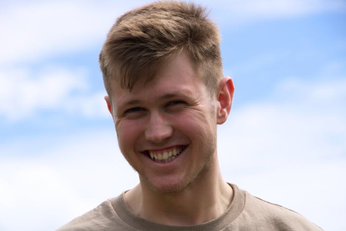 Male Student smiling at the camera