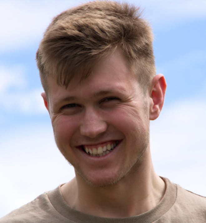 Male Student smiling at the camera