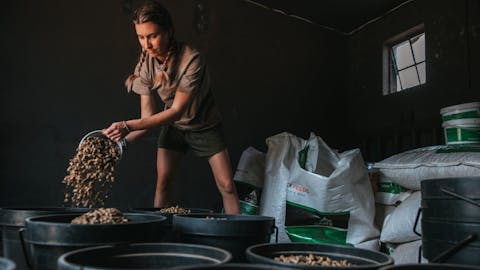 ACE volunteer gathering the feed for rhinos, The Rhino Orphanage