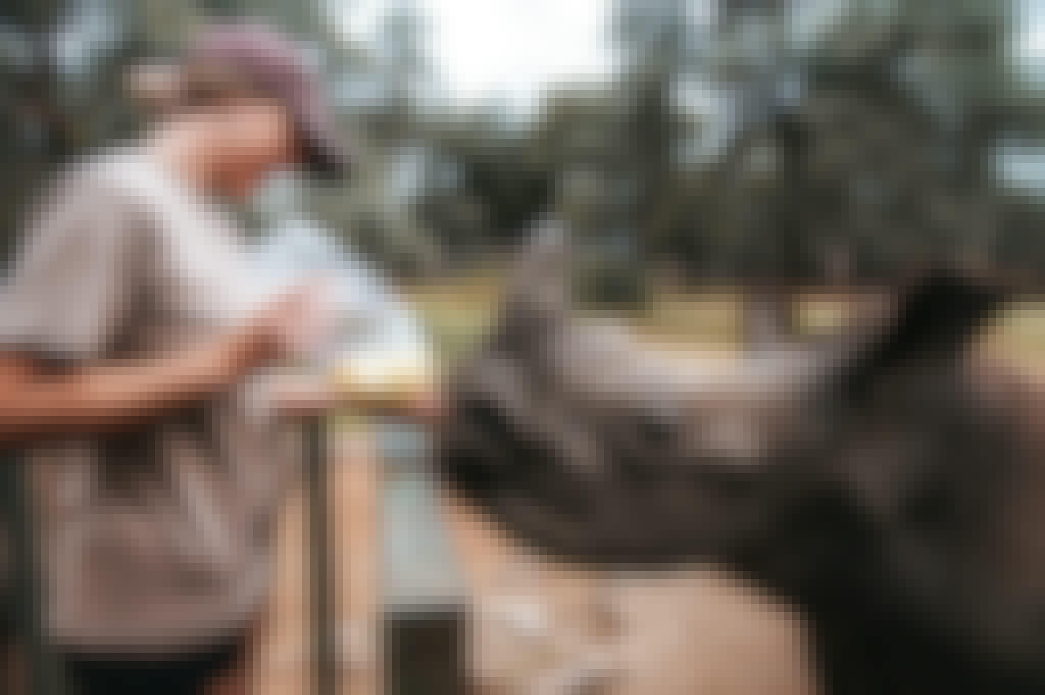 ACE volunteer bottle feeding a rhino calf, close up, The Rhino Orphanage