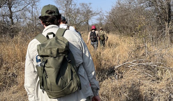 Liam Corcoran and Emily Munroe: hiking in the bush