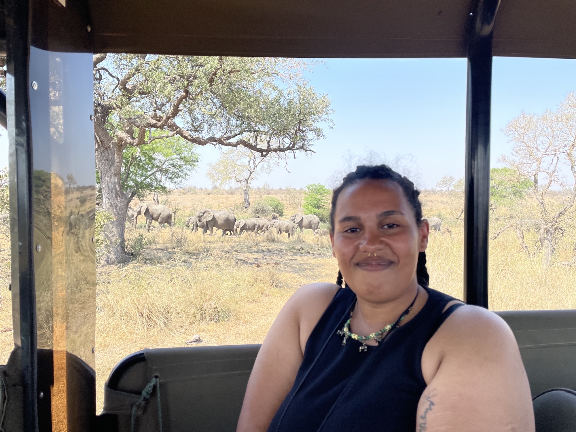Liam Corcoran and Emily Munroe: in vehicle with elephants in the background