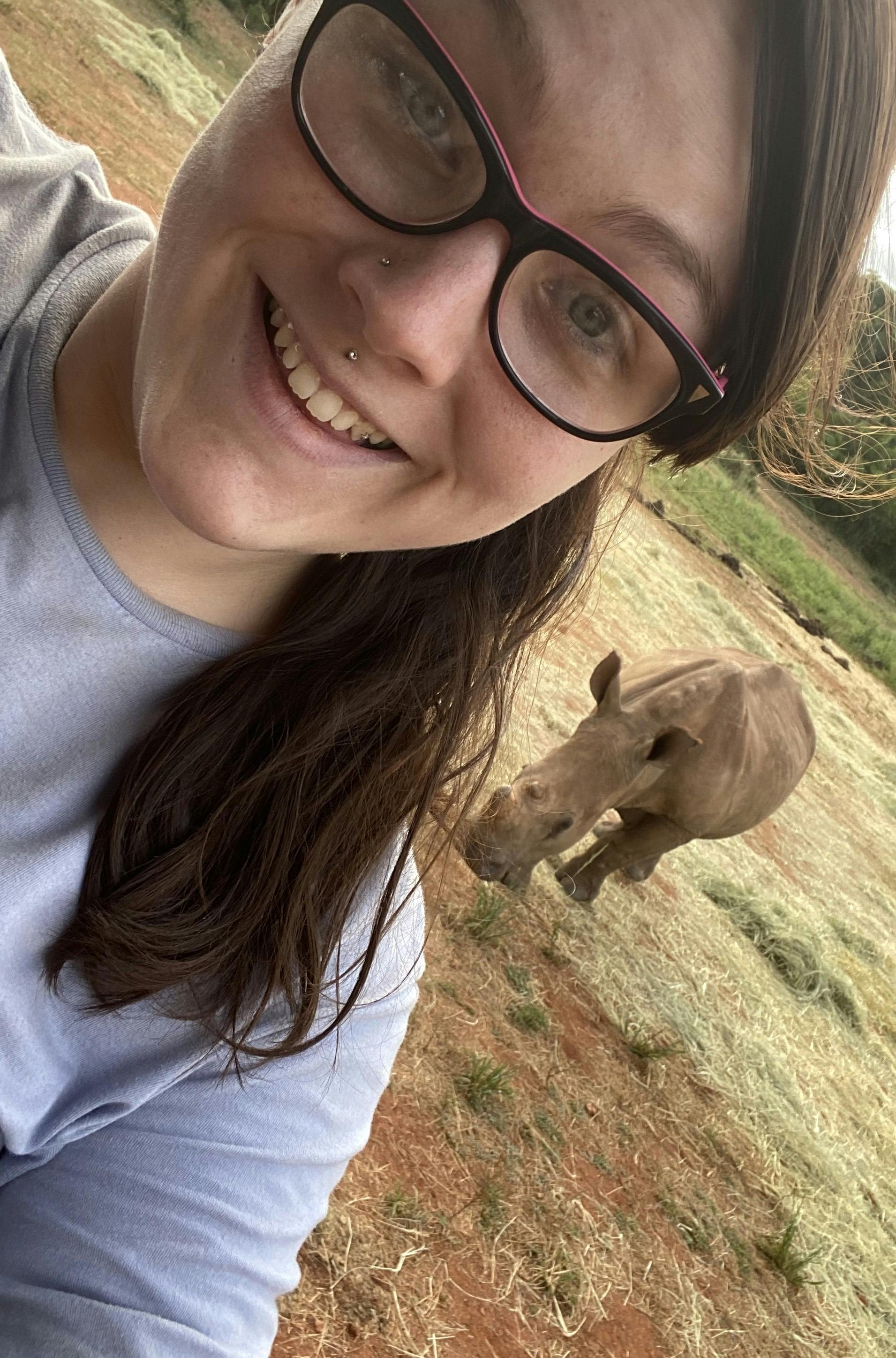Chandra Kelton: baby rhino in the background
